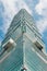 Taipei 101 building that view from below with bright blue sky and cloud in Taipei, Taiwan. Landmark and modern architecture