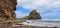 Taitomo Island at Piha Beach panoramic view, New Zealand