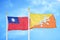 Taiwan and Bhutan two flags on flagpoles and blue sky