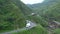 TAIWAN, JIUFEN - MAY, 2023: Aerial Footage of the Golden Waterfall, famous landmark in Jiufen, Taiwan