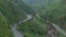 TAIWAN, JIUFEN - MAY, 2023: Aerial Footage of the Golden Waterfall, famous landmark in Jiufen, Taiwan