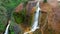 TAIWAN, JIUFEN - MAY, 2023: Aerial Footage of the Golden Waterfall, famous landmark in Jiufen, Taiwan