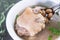 Taiwan`s distinctive famous snacks: Peanut pork knucklepig`s trotter soup in a white bowl on stone table, Taiwan Delicacies