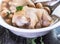 Taiwan`s distinctive famous snacks: Peanut pork knucklepig`s trotter soup in a white bowl on stone table, Taiwan Delicacies
