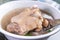 Taiwan`s distinctive famous snacks: Peanut pork knucklepig`s trotter soup in a white bowl on stone table, Taiwan Delicacies