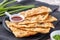 Taiwanese food - delicious flaky scallion pie pancakes on bright wooden table background