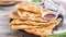 Taiwanese food - delicious flaky scallion pie pancakes on bright wooden table background