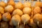 Taiwanese fried fish balls on stick at food street market in Taipei, Taiwan.