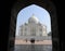 Taj Mahal from an arched portal of adjacent mosque