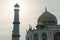 Taj Mahal dome and tower minar against sunset