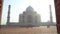 Taj Mahal front view from entrance with wooden doors.