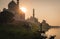 Taj mahal with indian prayer and a cow at sunset on the river