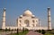 The Taj Mahal is an ivory-white marble mausoleum on the south bank of the Yamuna river in Agra, India