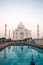 Taj Mahal monument with reflecting in water with tourist visiting in Indiaa.