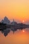 Taj Mahal reflected in Yamuna river at sunset in Agra, India