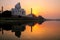 Taj Mahal reflected in Yamuna river at sunset in Agra, India