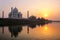 Taj Mahal reflected in Yamuna river at sunset in Agra, India