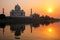 Taj Mahal reflected in Yamuna river at sunset in Agra, India