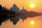 Taj Mahal reflected in Yamuna river at sunset in Agra, India