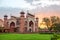 Taj Mahal`s western gate at sunrise, Agra, India