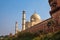 Taj Mahal in sun light. Early in the morning, back view behind the fence, from outside, river side. One of the most