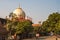 Taj Mahal in sun light. Early in the morning, back view behind the fence, from outside, street side. One of the most