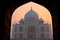 Taj Mahal at sunrise framed with the arch of the mosque, Agra, U