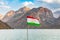 Tajik flag and mountain at Iskanderkul Lake