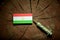Tajikistan flag on a stump with syringe injecting money