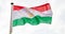 Tajikistan flag waving against cloudy sky background