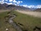 Tajikistan. Mountain stream flowing down from the barren peaks o