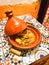 Tajin on the table in Morocco. Traditional Moroccan ceramic tagine dish