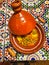 Tajin on the table in Morocco. Traditional Moroccan ceramic tagine dish