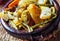 Tajine or tagine - traditional Berber dish served in earthenware bowl at typical Moroccan street restaurant, closeup