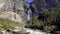 Takakkaw Falls Waterfall and Yoho River in a sunny summer day. Yoho National Park, Canadian Rockies