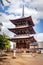TAKAYAMA, JAPAN - SEPTEMBER 23; 2019: The Hida Kokubunji Buddhist Triple Pagoda stands proud on a sunny Autumn day. A National His