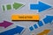 Take Action text on sticky notes isolated on office desk