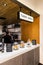 Take Away counter of Black, white and wooden industrial decorated interior design, Coffee bar decorated with white granite.