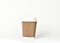 Take away disposable paper coffee cup on white background.