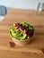 Take Away Healthy Vegan Food Bowl with Mexican Kidney Beans, Broccoli, Boiled Chickpea and Brussell Sprouts on Wooden Table