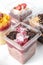 take away trifle cake in a box. chocolate sponge bisquit with mascarpone and cherry berry jam filling. coconut and