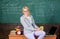 Take a break to relax. Working conditions which prospective teachers must consider. Woman smiling teacher holds mug