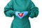 Take care concept, surgeon doctor in green gown action to protect red heart