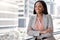 Take charge of your dreams. a confident young businesswoman leaning against a window.