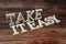 Take It Easy Word alphabet letters on wooden background