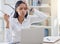 Take a few deep breaths. a young businesswoman suffering from a headache at work.