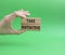 Take initiative symbol. Wooden blocks with words Take initiative. Beautiful green background. Businessman hand. Business and Take