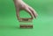 Take initiative symbol. Wooden blocks with words Take initiative. Beautiful green background. Businessman hand. Business and Take