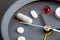 Take medicine on time! Creative healthcare and medicine concept - clock with drugs and pills. Cold and flu season. Period of