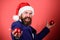 Take it. merry christmas. bearded man santa hat hold red xmas ball. be creative. mature event manager. businessman